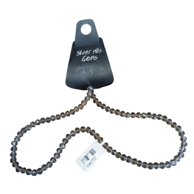 Glass bead string, faceted, rondelle, 5x7mm, smoky grey, 40cm