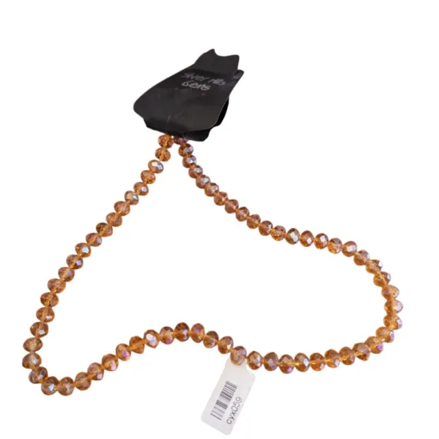 Glass bead string, faceted, rondelle, 6x8mm, amber AB, 40cm